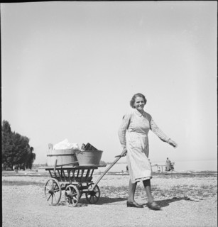 Woman with laundry to wash at Lake Constance, 1944.