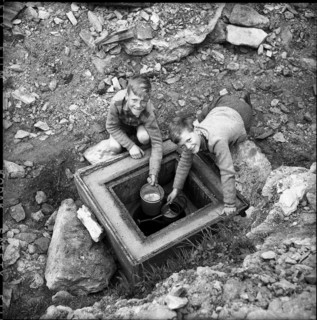 Brigerbad, boys getting water at Thermal spring; 1957.