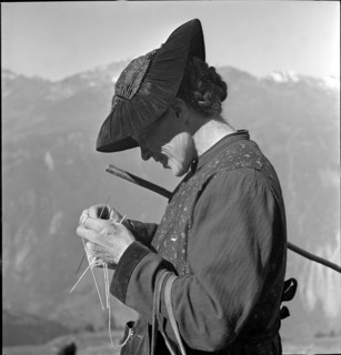 Woman knitting on the Alpine pasture, Valais 1942.