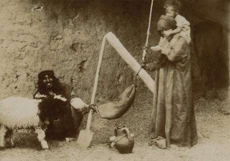 Arabs making butter. 
	
		1920-1940