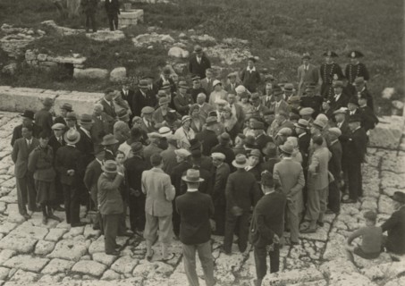 A small group around a guide. 
	
		1924