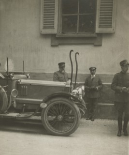 Frederick Johnson next to a car. 1915-1925