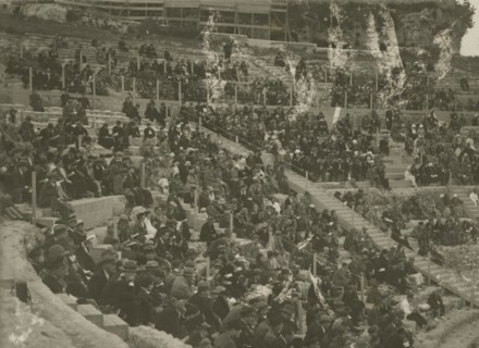 The Greek Theatre of Syracuse packed with people.