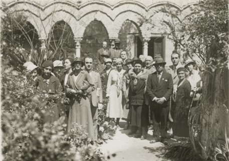 Members of the Touring Club Italiano visiting the cloister of Monreale Cathedral. 
	
		1924