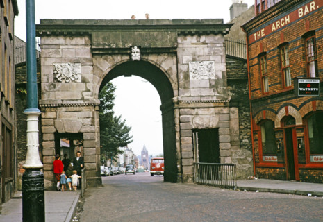 Bishop's Gate part of the old city walls built 1789, and The Arch Bar pub, Derry Londonderry,