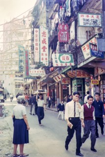 Captioned as 'Chinese flower stalls', Victoria, Hong Kong, Asia 1964 - note bamboo scaffolding.