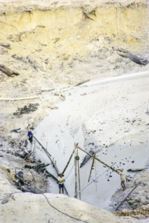 Open Cast gravel-pumping tin mine Malaya, Malaysia, south east Asia 1964 -  high pressure water