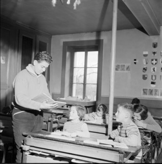 Boy giving lesson, filling in for the sicken teacher, Chavannes-des-Bois 1957
