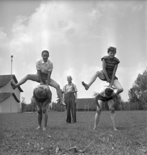 Wangi, teacher giving an outdoor gym lesson, 1955