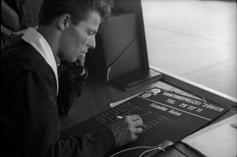 Policeman with panel searched cars, 1962