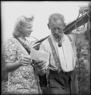 Alpnachstad, postwoman bringing mail to farmers, 1944