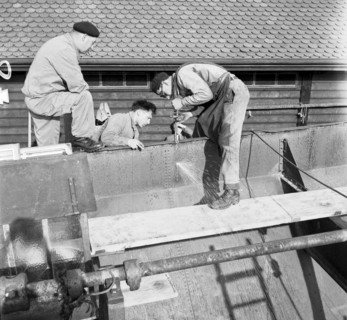 Preparation of overland ship transpor, cutting hull in two with blowtorch, 1946
