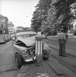 Car clash into road safety pile, traffic island on Universitatsstrasse Zurich 1959