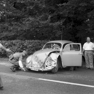 Car, hood dameged in an accident near Gruyere 1959