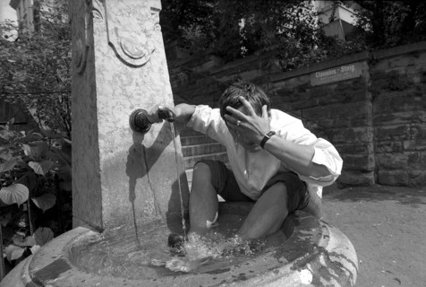 Heat in Zurich, young man cooling down 1970