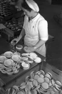 Worker packing up cheese in Roethlisberger cheese export in Langnau, canton of Berne, 1944