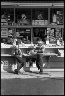 Boys buying sweets at a kiosk, Zurich 1966