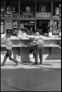 Boys buying sweets at a kiosk, Zurich 1966