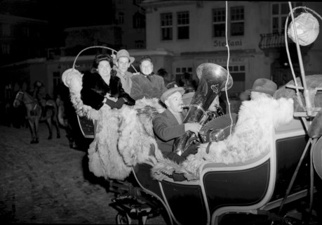 Tourists enjoy a nighttime sleigh-ride in St. Moritz, 1947
