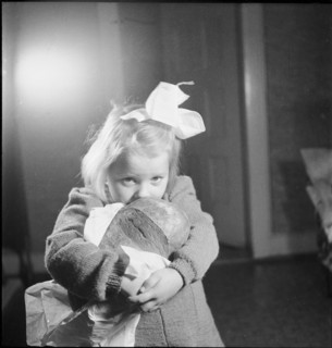 Girl with loaf of bread, approx. 1950
