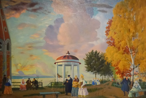 Merchants walk along the shore of the Volga river