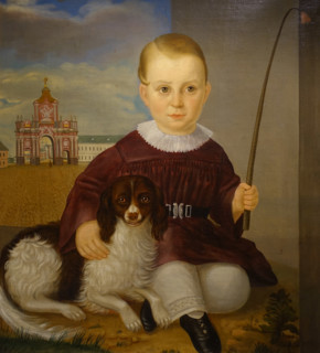 Portrait of a boy with a dog against the background of the Red Gate in Moscow