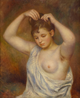 Woman arranging her hair