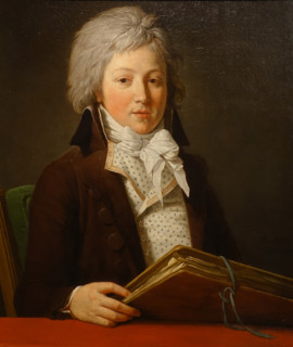 Portrait of a youth holding a folder with drawings