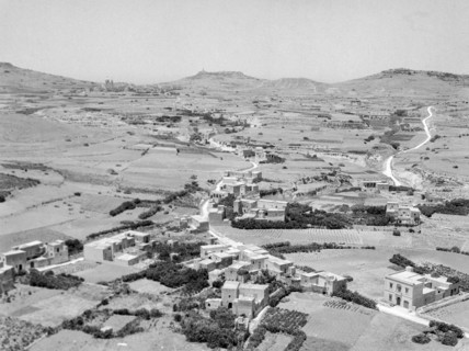 View from citadel in Victoria over countryside looking towards Ghasri and Giordan lighthouse in distance.