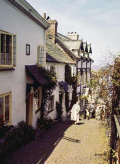 Steep hill of cobbled main street in coastal village of Clovelly.
