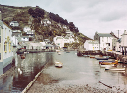 Historic waterfront buildings around the harbour river mouth of the River Pol at village of Polperro.