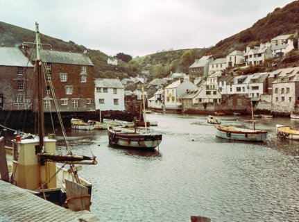 Historic waterfront buildings around the harbour river mouth of the River Pol at village of Polperro.