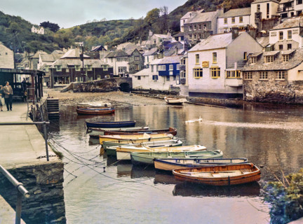Historic waterfront buildings around the harbour river mouth of the River Pol at village of Polperro.