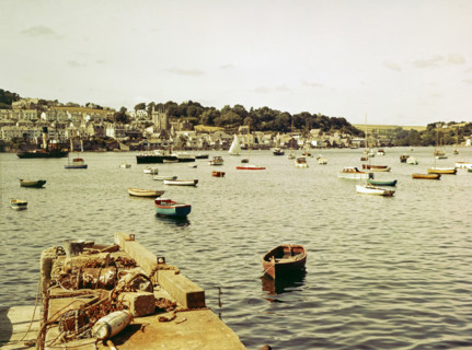 Boats at moorings in harbour of town Fowey.