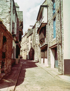 Historic buildings cobbled street  including listed Elizabethan House with distinctive jettied.