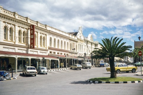 High Street (now known as Upperton) in Grahamstown (Makhanda), South Africa. The prominent vertical red sign is for the Lewis department store