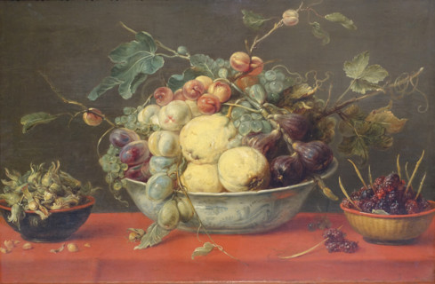 Fruits in a bowl on a red tablecloth.