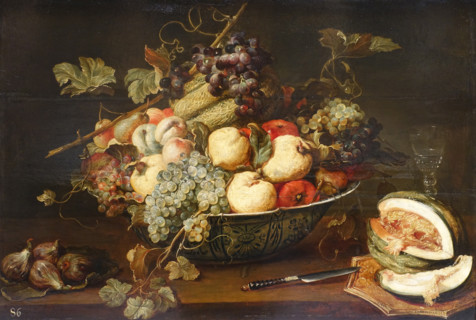 Fruit in a bowl and a cut melon.