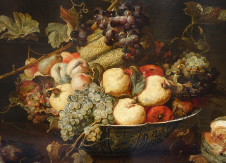 Fruit in a bowl and a cut melon.