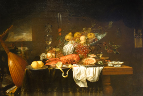 Lobster, oysters and fruit on the table.