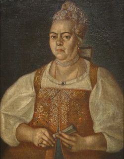 An unknown Arkhangelsk merchant's wife in a brown sleeveless jacket.