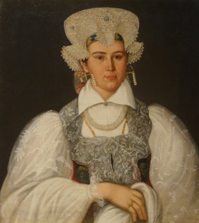 An unknown merchant's wife in a festive costume of the Novgorod province.