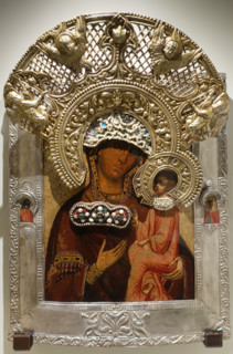 Icon of the Mother of God of Tikhvin with images of saints in the margins.
