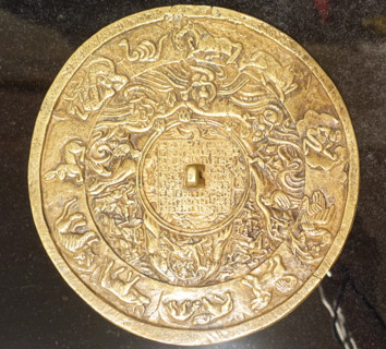Disk amulet.