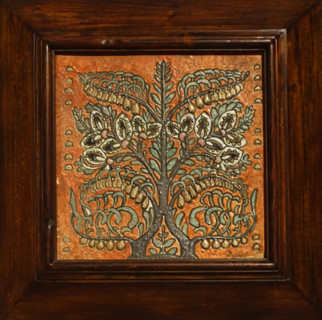 Tile in a wooden frame with a stylized image of a flowering bush.