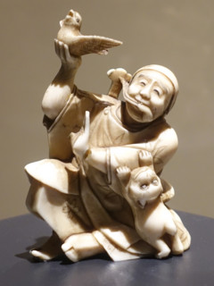 Okimono ""Man with a Bird and a Kitten"".