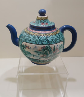 Teapot with landscapes.