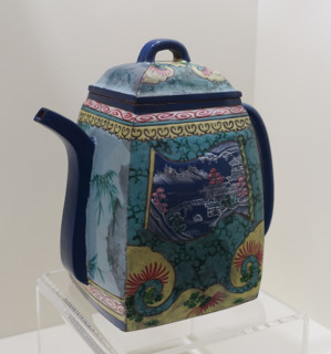 Teapot with a landscape and calligraphic inscription.