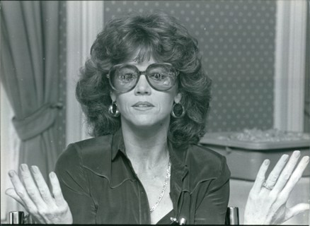 Actress Jane Fonda gesturing with her hands, wearing glasses