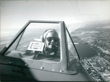 The Pepsi skywriting girl Suzanne Asbury in flight